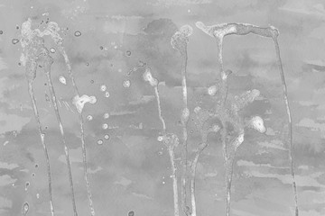Silver, gray wet abstract paint leaks and splashes texture on white watercolor paper background. Natural organic shapes and design.