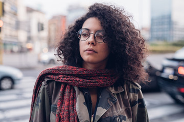 young and curly girl in the street