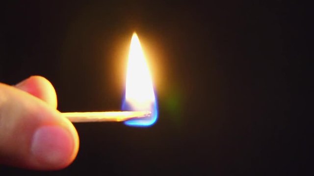 match ignition on a dark background