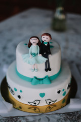  wedding cake with figures of the bride and groom