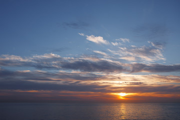sunrise at ocean seascape with reflection