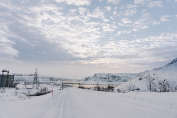 view of the village beyond the Arctic Circle in winter under a thick layer of snow more in extreme cold