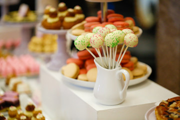 Delicious cake pops on candy bar
