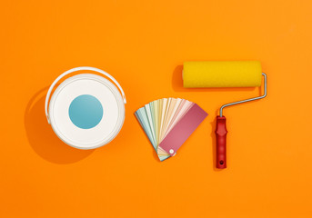 Professional painter work tools on orange background © stokkete