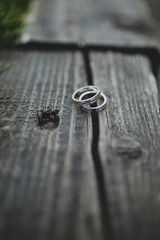 wedding rings on wooden background