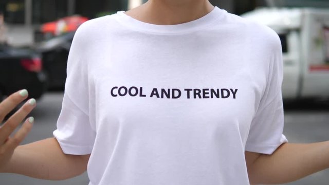 Young Stylish Girl Wearing A White Cool And Trendy T-Shirt In City