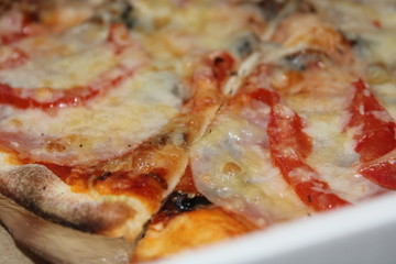 pizza with ham and cheese in box