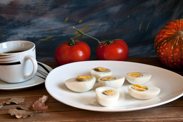 boiled egg with tomato and black coffee