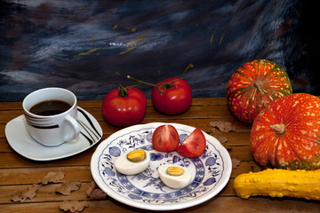 boiled egg with tomato and black coffee