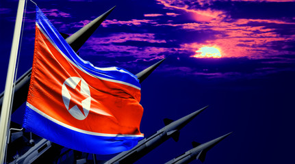 Nuclear missiles and North Korea flag in background