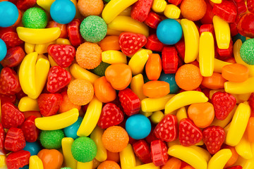 Fototapeta na wymiar Top view on background texture of colorful hard candies. Copy space for text.