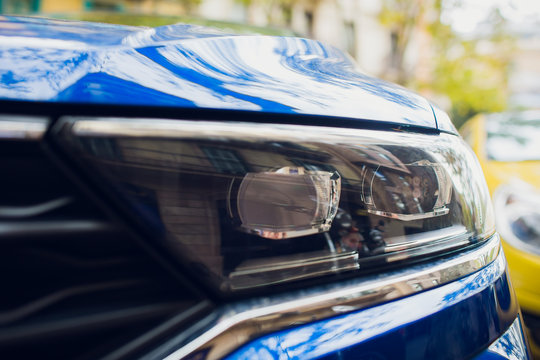 Macro View Of Modern Blue Car Xenon Lamp Headlight.