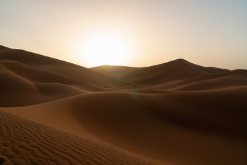Fototapeta na wymiar Sunrise on sand dunes, Sahara Sand dunes africa morocco