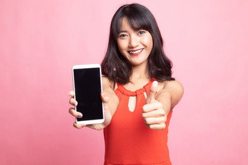 Young Asian woman show thumb up  with mobile phone.
