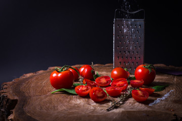 Red fresh tomatoes, grater, salt, bay leaf and parsley.
