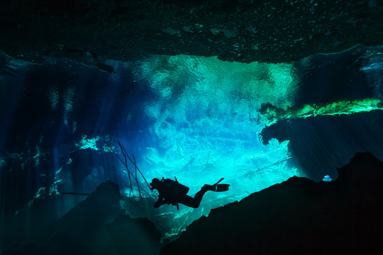 Diver exploring underwater world of Azul cenote
