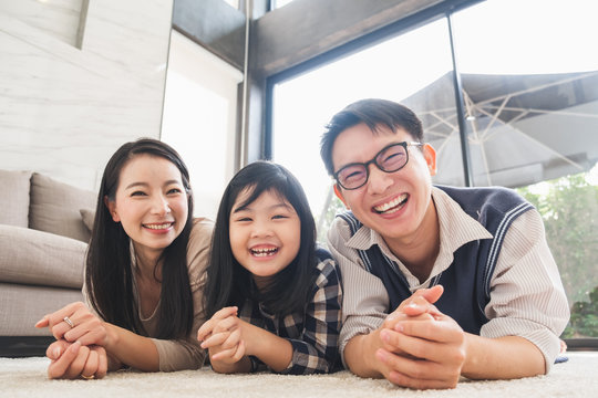 Portrait Happy Asian Family At Living Room