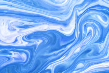 Obraz na płótnie Canvas Blue and white paint pigment mix. Ornament mosaic swirl shapes background.