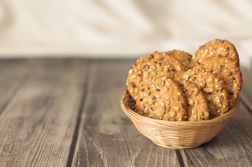 Oatmeal cookies with cereals on a wooden table