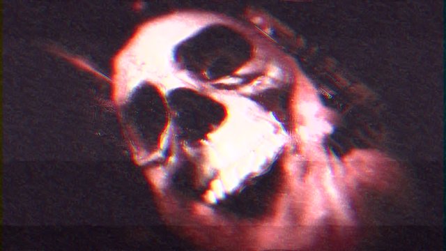 Intentional noise distortion fx tv transmission: a scary human skull, covered with spider webs and other nasty stuff. Red color tone.