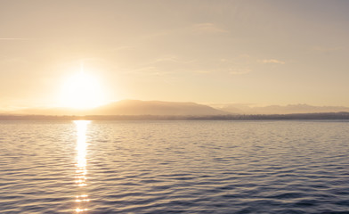 Fototapeta premium A beautiful sunrise over a lake that motivates you to work.