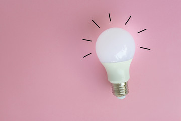 LED bulb with lighting and lighting line from drawing on the pink background for idea concept