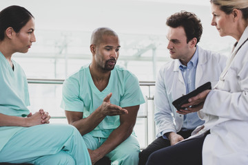 African American medical professional discussing patient treatment in a hospital