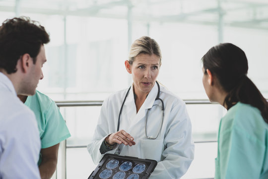 Medical professionals discussing results in a hospital