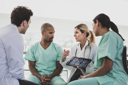 Medical professionals discussing patient treatment in a hospital