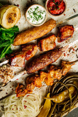 Set of restaurant grillmenu with skewers of chicken, pork, lamb and beef