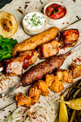 Set of restaurant grillmenu with skewers of chicken, pork, lamb and beef