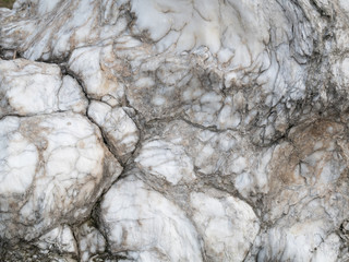 raw aged white marble stone with abstract pattern