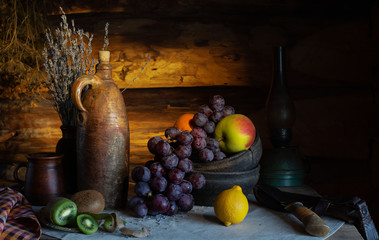 Still life in a rustic style. ceramic dishes and  fruits 