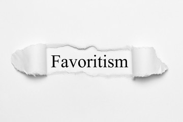 Favoritism on white torn paper