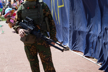 silhouette of a man with a gun in his hand .
