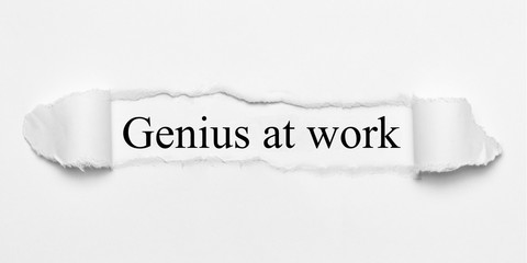 Genius at work on white torn paper