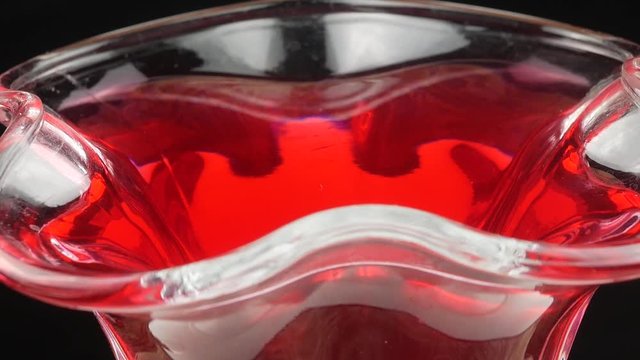 Tasty red jelly in bowl. red substance in a glass bowl