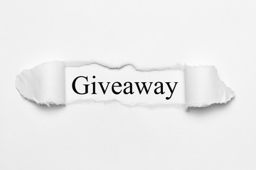 Obraz premium Giveaway on white torn paper