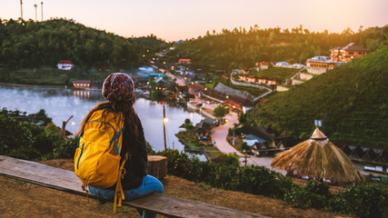 Female travelers travel nature mountain. Travel in trip Ban Rak Thai village in the countryside at Mae Hong Son, in Thailand.