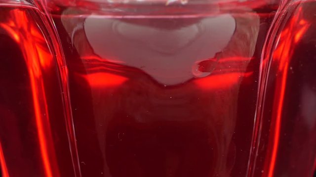 Tasty red jelly in bowl. red substance in a glass bowl