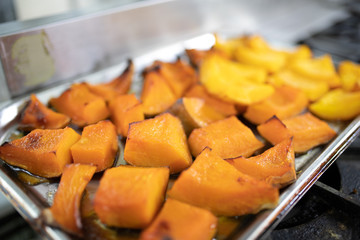 Pumpkin baked on a baking sheet. Healthy vegan food concept. honey pumpkin baked in the oven