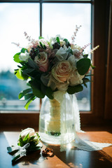 bouquet of flowers of the bride on the window