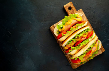 delicious hot dogs on a stone background with copy space for your text
