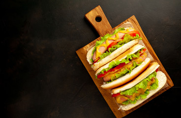 delicious hot dogs on a stone background with copy space for your text