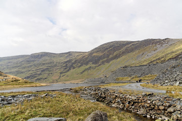 A view of the lake on the Cwmorthin Waterfall trail in the mountains of Snowdonia National Park, Wales.