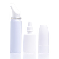 White bottles nose spray on white background isolation. Pharmacy and medicine concept