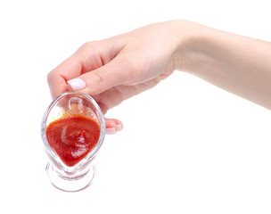 sauceboat tomato in hand on white background isolation