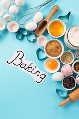 Fototapeta na wymiar Ingredients and utensils for baking, blue background