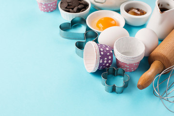 Obraz premium Ingredients and utensils for baking, blue background