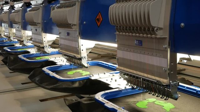 Professional embroidery machine. Needle with thread.